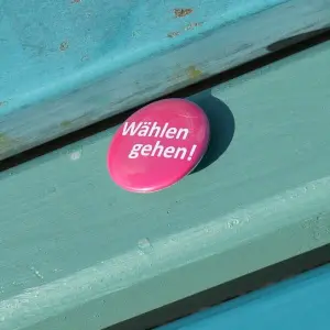 Ein Anstecker der Kampagne 